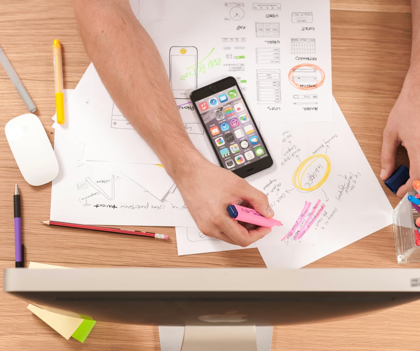 Marketing planning desk with sketches and campaign notes